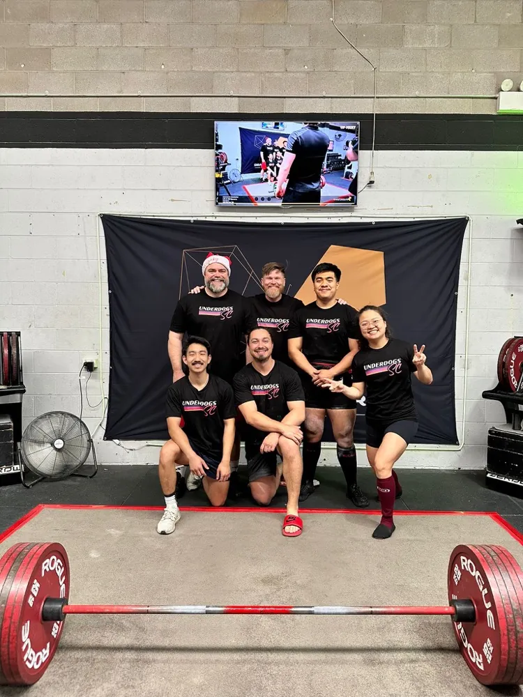 The Underdogs SC crew together in club shirts after a meet